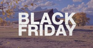 A rustic Wyoming barn with the words “Black Friday” overlaid, representing small business holiday marketing in rural communities.