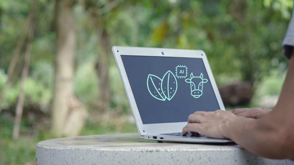 AI digital marketing agency pricing concept shown on a laptop screen, illustrating how AI tools improve marketing efficiency, reduce production time, and support human-led strategy.