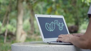 AI digital marketing agency pricing concept shown on a laptop screen, illustrating how AI tools improve marketing efficiency, reduce production time, and support human-led strategy.